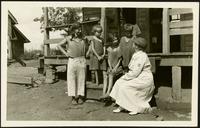 American Women's Hospitals Service and an Appalachian Mountain family (photograph), circa 1935<blockquote class="juicy-quote">An [unidentified] doctor (in hat) from the American Women’s Hospital Service sits on the front steps of a porch in rural 1930s Appalachia with a local woman and children.</blockquote><div class="view-evidence"><a href="https://doctorordoctress.org/islandora/object/islandora:1859/story/islandora:2084" class="btn btn-primary custom-colorbox-load"><span class="glyphicon glyphicon-search"></span> Evidence</a></div>